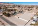 Aerial view of a luxury home with pool, large lot, and distant mountain views at 9390 Stange Ave, Las Vegas, NV 89129