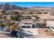 Aerial view of house with attached garage and pool at 9390 Stange Ave, Las Vegas, NV 89129