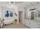 Elegant bathroom with freestanding tub, granite vanity, and large mirror at 9390 Stange Ave, Las Vegas, NV 89129