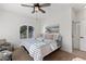 Bright bedroom with a king-size bed and ocean-themed decor at 9390 Stange Ave, Las Vegas, NV 89129