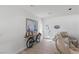 Inviting entryway with a stylish bicycle console table and comfortable seating at 9390 Stange Ave, Las Vegas, NV 89129