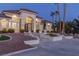 Grand home entrance with ornate iron gate and fountain at 9390 Stange Ave, Las Vegas, NV 89129