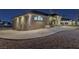 Night view of a single-story home with a landscaped yard and driveway at 9390 Stange Ave, Las Vegas, NV 89129