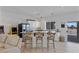 Modern kitchen with white cabinetry, granite counters, and an island at 9390 Stange Ave, Las Vegas, NV 89129