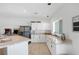 Spacious kitchen with granite countertops, white cabinets, and stainless steel appliances at 9390 Stange Ave, Las Vegas, NV 89129