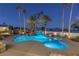 Luxury pool with waterfall feature at night at 9390 Stange Ave, Las Vegas, NV 89129