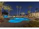 Luxury pool and backyard oasis at night at 9390 Stange Ave, Las Vegas, NV 89129