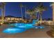 Luxury pool with waterfall feature at night at 9390 Stange Ave, Las Vegas, NV 89129