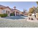 Landscaped backyard with gravel and desert plants at 9520 Yucca Blossom Dr, Las Vegas, NV 89134