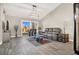 Spacious living room featuring a gray sectional sofa and large windows at 9520 Yucca Blossom Dr, Las Vegas, NV 89134