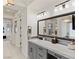 Modern bathroom with double vanity and large mirror at 1 Panorama Crest Ave, Las Vegas, NV 89135