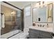 Modern bathroom with gray vanity and honeycomb tile shower at 1 Panorama Crest Ave, Las Vegas, NV 89135