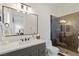 Stylish bathroom with a dark-tile shower and modern vanity at 1 Panorama Crest Ave, Las Vegas, NV 89135