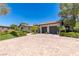 Front view of house, driveway, landscaping, and two car garage at 1 Panorama Crest Ave, Las Vegas, NV 89135