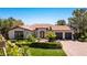 Single story home with Spanish tile roof, landscaping and two-car garage at 1 Panorama Crest Ave, Las Vegas, NV 89135