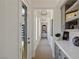 Bright entry hallway with built-in shelving and natural light at 1 Panorama Crest Ave, Las Vegas, NV 89135