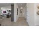 Clean and bright hallway with tile floors and modern artwork at 1 Panorama Crest Ave, Las Vegas, NV 89135