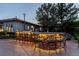 Outdoor kitchen with bar seating and lighting at 1 Panorama Crest Ave, Las Vegas, NV 89135