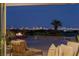 Evening view of patio with fire pit, seating, and city skyline at 1 Panorama Crest Ave, Las Vegas, NV 89135