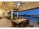 Covered patio with dining area, pool view, and city skyline at 1 Panorama Crest Ave, Las Vegas, NV 89135