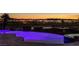 Luxury pool with city views at sunset; spa and landscape lighting at 1 Panorama Crest Ave, Las Vegas, NV 89135