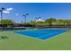 Well-maintained tennis courts with green surrounding at 1 Panorama Crest Ave, Las Vegas, NV 89135