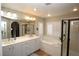 Double vanity bathroom with soaking tub and shower at 10418 Prairie Mountain Ave, Las Vegas, NV 89166