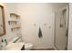 Clean bathroom with shower, shelves and floating hooks at 10418 Prairie Mountain Ave, Las Vegas, NV 89166