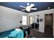 Bedroom with mirrored closet doors and a ceiling fan at 10418 Prairie Mountain Ave, Las Vegas, NV 89166