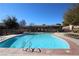 Large community pool with plenty of lounge chairs at 10418 Prairie Mountain Ave, Las Vegas, NV 89166