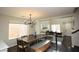 Farmhouse style dining room with wooden table and bench seating at 10418 Prairie Mountain Ave, Las Vegas, NV 89166