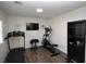 Home gym with treadmill, elliptical, and weight equipment at 10418 Prairie Mountain Ave, Las Vegas, NV 89166