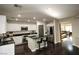 Modern kitchen with white cabinets, granite island, and stainless steel appliances at 10418 Prairie Mountain Ave, Las Vegas, NV 89166