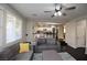 Living room with view into kitchen and lots of natural light at 10418 Prairie Mountain Ave, Las Vegas, NV 89166