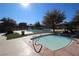 Community pool and spa area with lush landscaping at 10418 Prairie Mountain Ave, Las Vegas, NV 89166