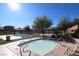 Community pool and spa area with lush landscaping at 10418 Prairie Mountain Ave, Las Vegas, NV 89166