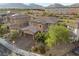 Two-story house with brick accents and a three-car garage, aerial view at 11952 Girasole Ave, Las Vegas, NV 89138