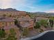 Two-story house with brick accents and a three-car garage, aerial view at 11952 Girasole Ave, Las Vegas, NV 89138