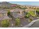 Two-story house with brick accents and a three-car garage, aerial view at 11952 Girasole Ave, Las Vegas, NV 89138