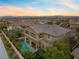 Luxury home with pool and mountain views at sunset at 11952 Girasole Ave, Las Vegas, NV 89138