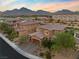 Two-story house with brick accents and a three-car garage, aerial view at 11952 Girasole Ave, Las Vegas, NV 89138