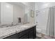 Bathroom with granite countertop, dark vanity, and shower/tub at 11952 Girasole Ave, Las Vegas, NV 89138