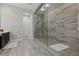 Spa-like bathroom featuring a large walk-in shower with a built-in seat at 11952 Girasole Ave, Las Vegas, NV 89138