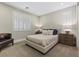 Bedroom with a queen-size bed and window shutters at 11952 Girasole Ave, Las Vegas, NV 89138