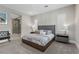 Main bedroom with plush bed, en-suite bathroom, and plenty of natural light at 11952 Girasole Ave, Las Vegas, NV 89138