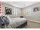 Bedroom with a striped bedspread and sports memorabilia at 11952 Girasole Ave, Las Vegas, NV 89138