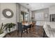 Charming dining area with wooden table and gray chairs near the kitchen at 11952 Girasole Ave, Las Vegas, NV 89138