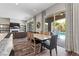 Bright dining area with sliding glass doors leading to a view of the pool at 11952 Girasole Ave, Las Vegas, NV 89138