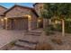 Brick home with a three-car garage and walkway leading to the entrance at 11952 Girasole Ave, Las Vegas, NV 89138