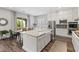 Bright kitchen with white cabinetry and a large island at 11952 Girasole Ave, Las Vegas, NV 89138